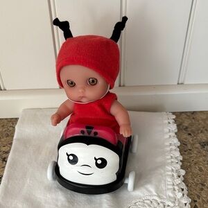 Lil’ Cutesies Red Ladybug Doll with Ride-On Buggie Car